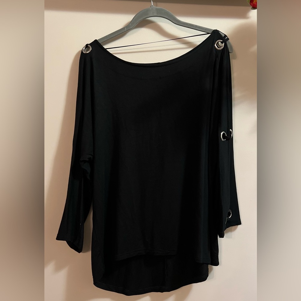 Woman’s Black blouse with silver rings